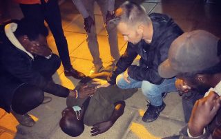Joshua Lindquist Ministering on the streets of Kenya to a young man
